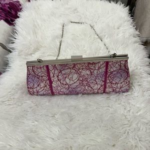 Woman’s slightly used pink and sliver purse w/chain